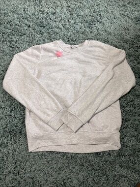 Light Gray Crewneck Women's Sweater with Pink Pom Accent